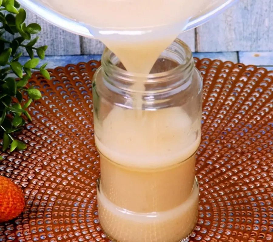 putting lychee Syrup in a jar